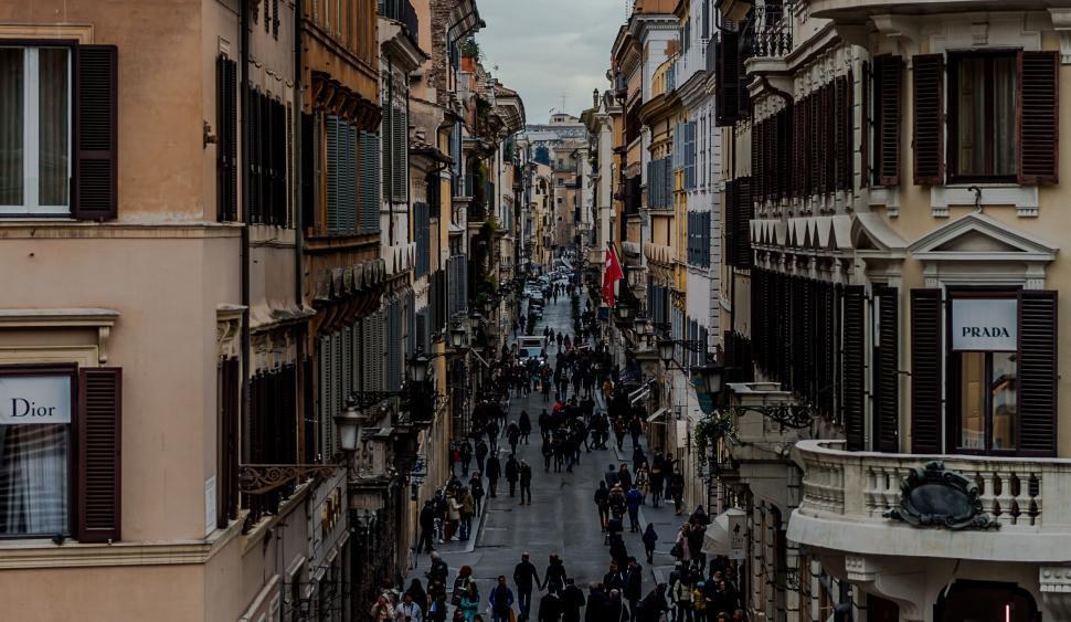 Free Image of A group of people walking down a street 