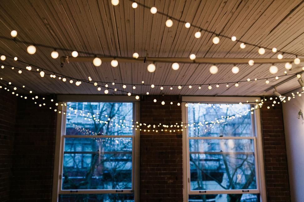 Free Image of A string of lights from a ceiling 