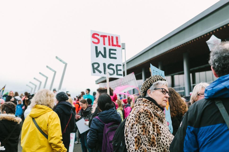 Free Image of A group of people holding signs 