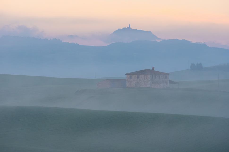 Free Image of A house in a foggy field 