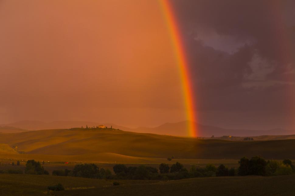 Free Image of A rainbow over a hill 