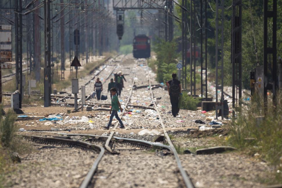 Free Image of People walking on train tracks 