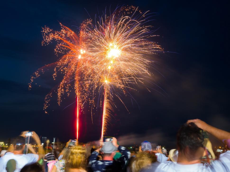 Free Image of A group of people watching fireworks 