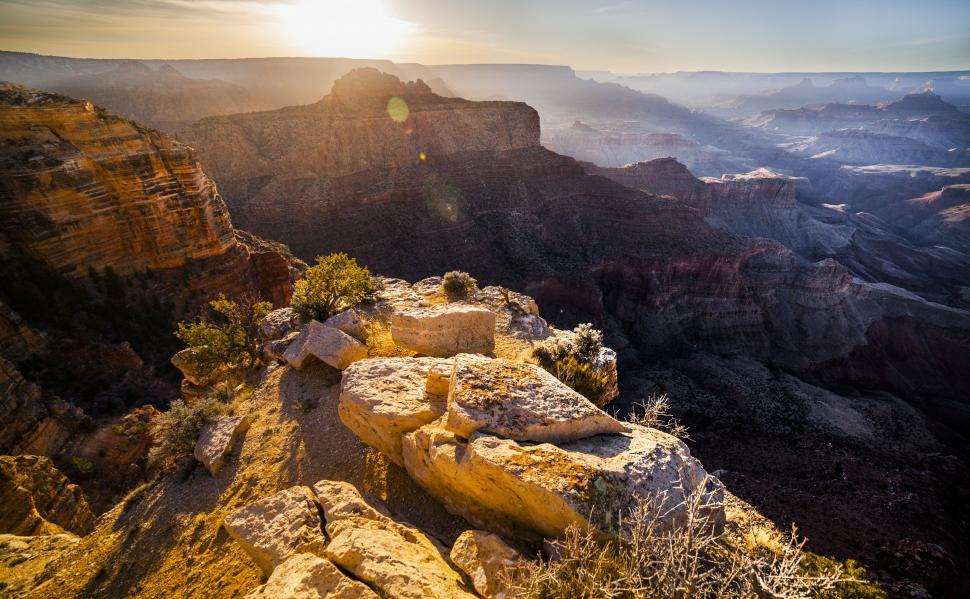 Free Image of A large rocky canyon with a valley below 