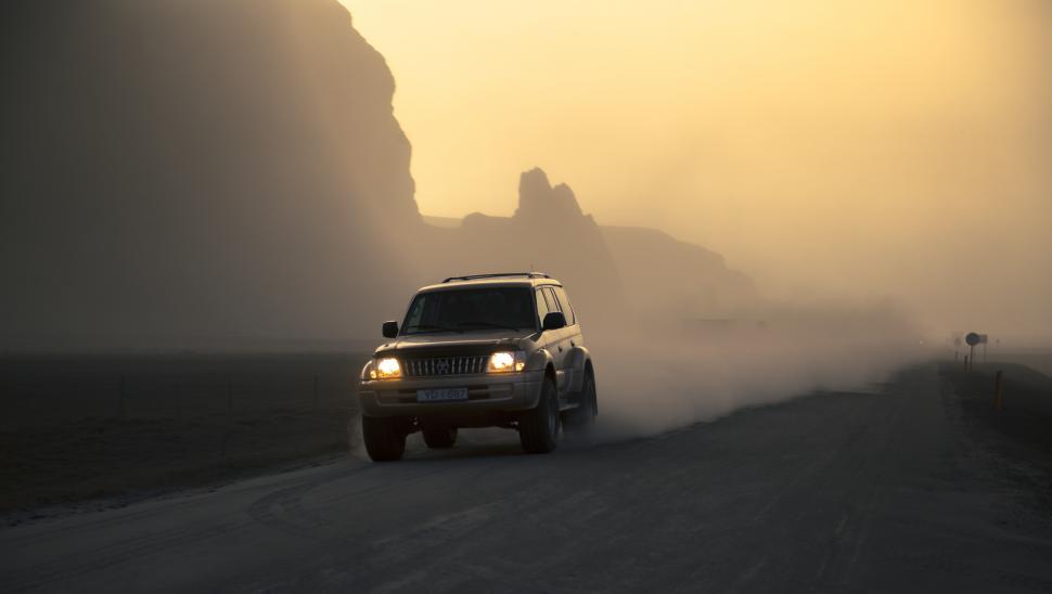 Free Image of A car driving on a road 