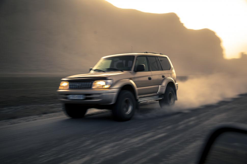 Free Image of A car driving on a road 