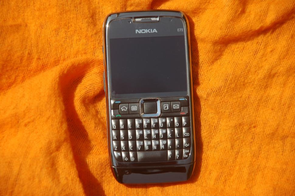 Free Image of Nokia Cell Phone on Bed 