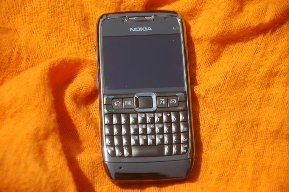Free Image of Cell Phone on Yellow Blanket 