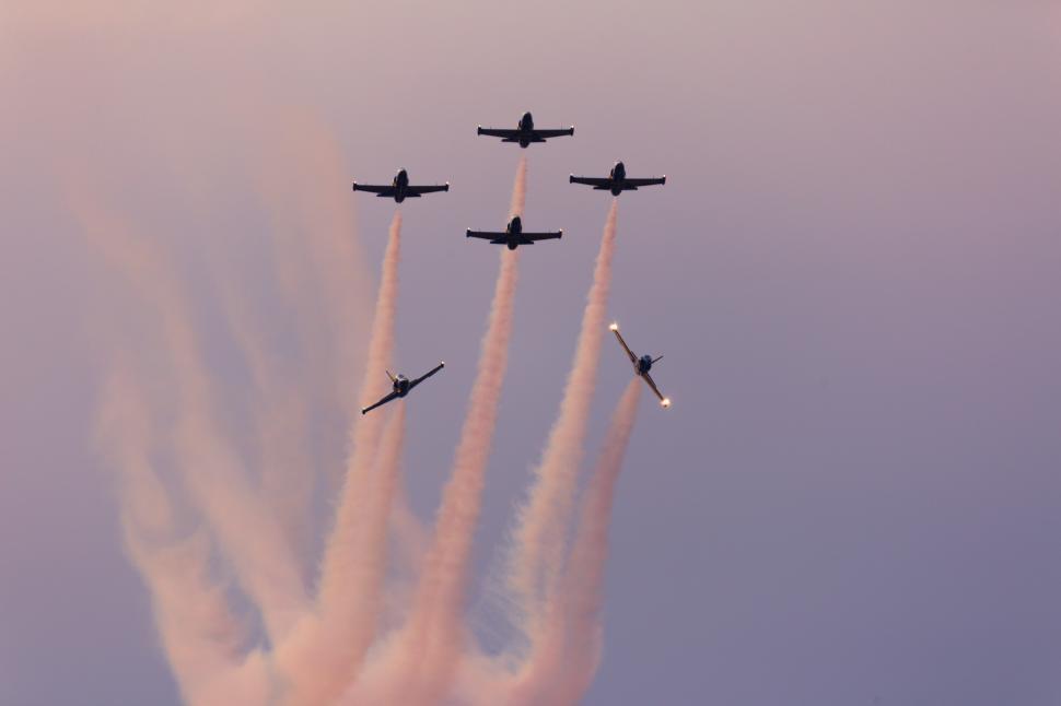 Free Image of A group of airplanes flying in formation 