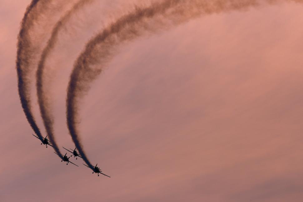 Free Image of A group of airplanes flying in the sky 