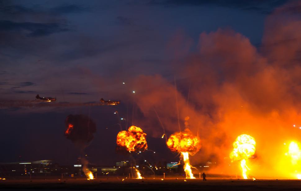 Free Image of A group of explosions in a field 