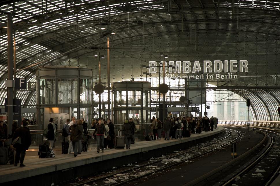 Free Image of A group of people at a train station 