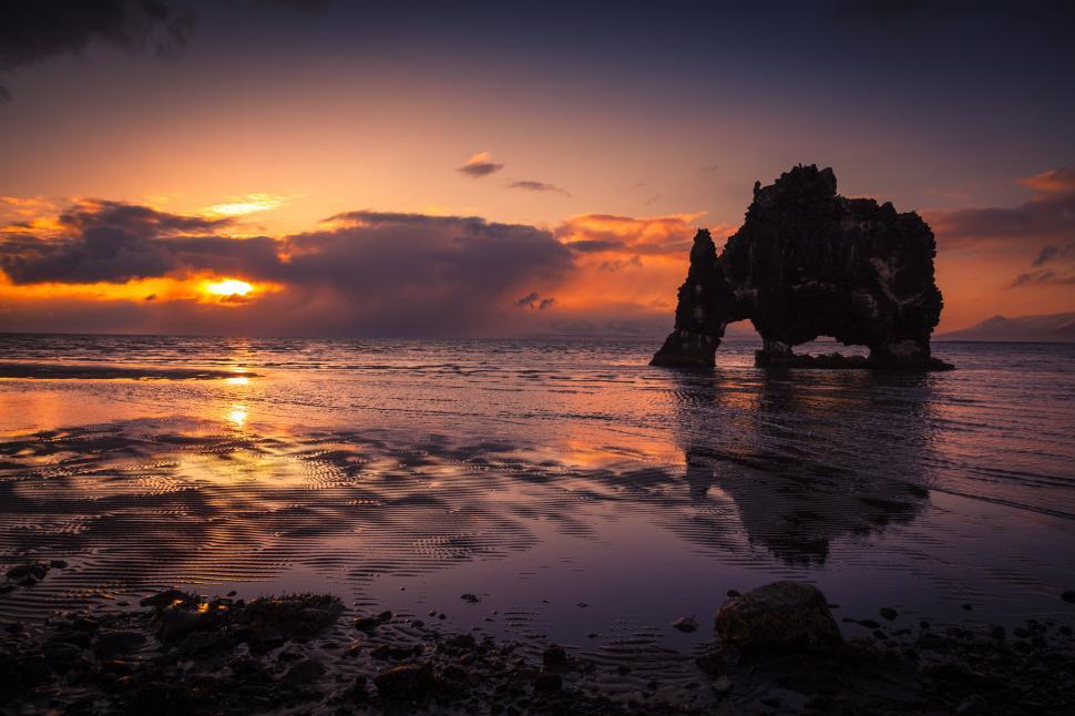 Free Image of A rock formation in the water 