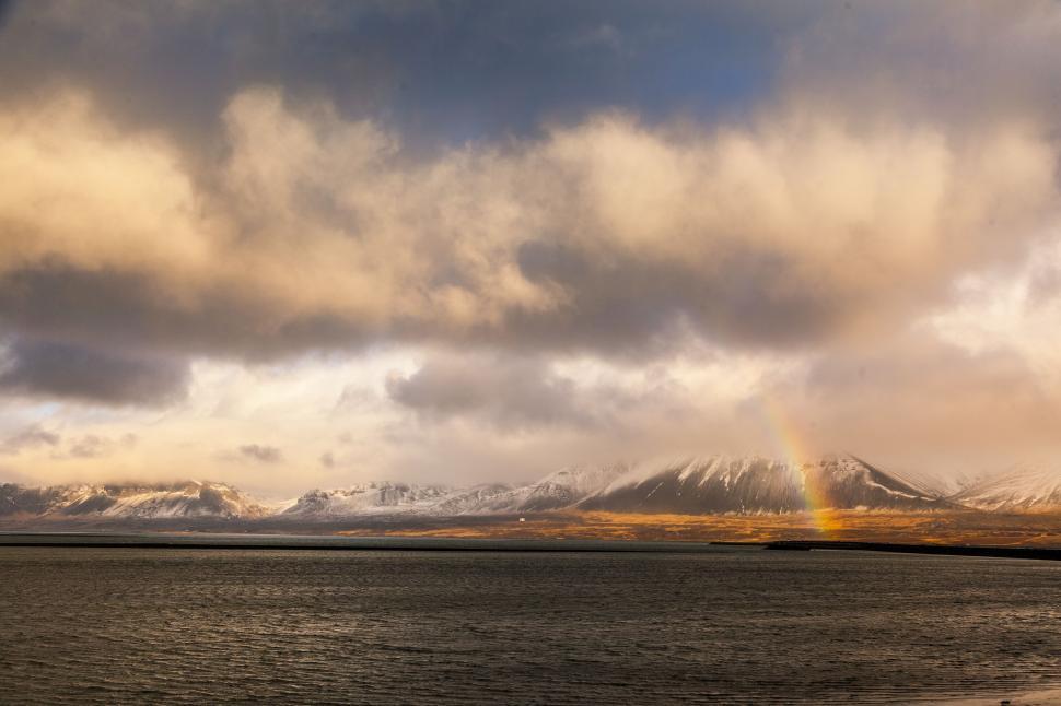 Free Image of A rainbow over a body of water 