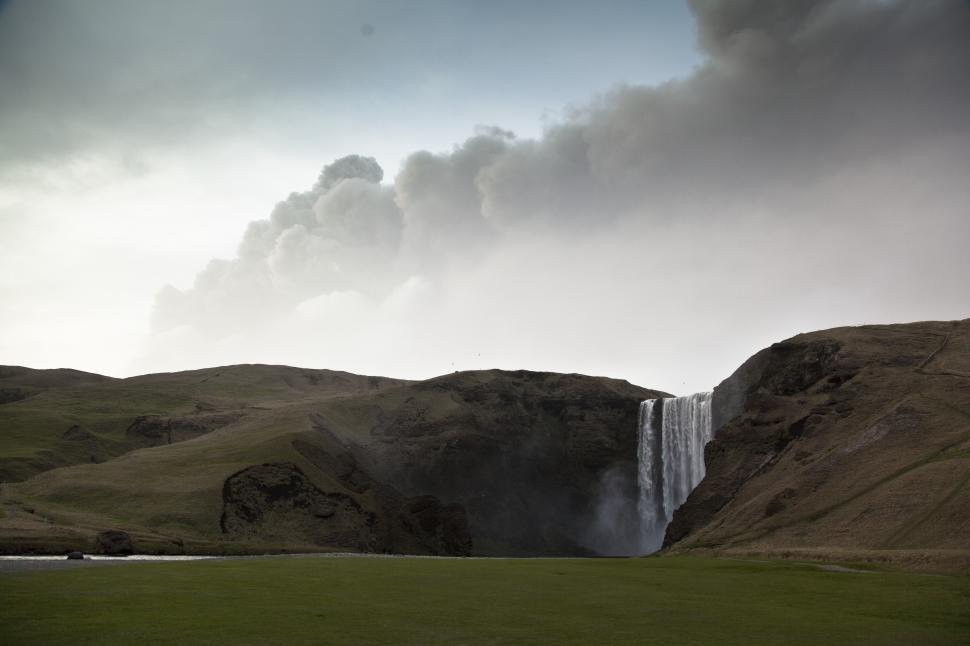 Free Image of A waterfall in a grassy area 