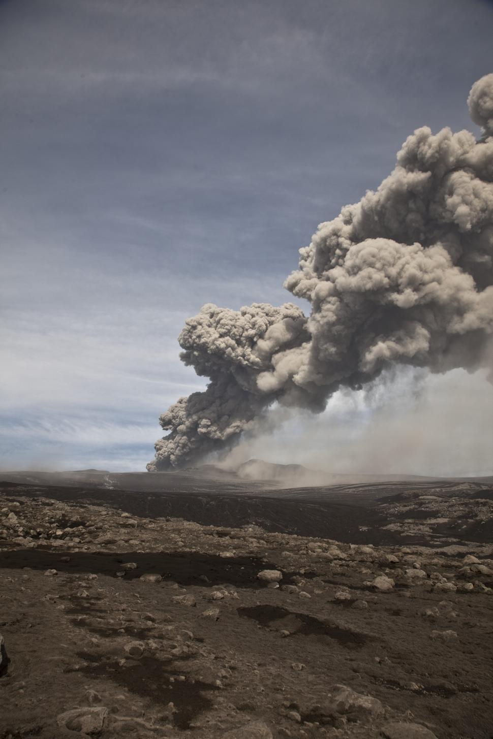 Free Image of A smoke coming out of a mountain 