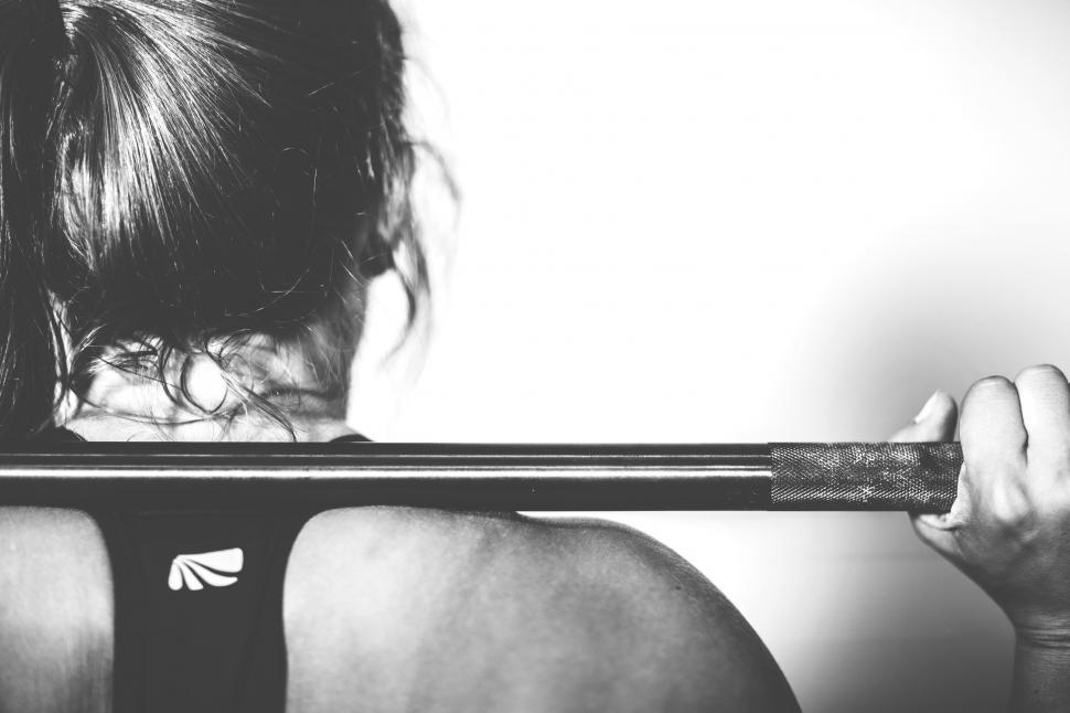 Free Image of A woman holding a bar 