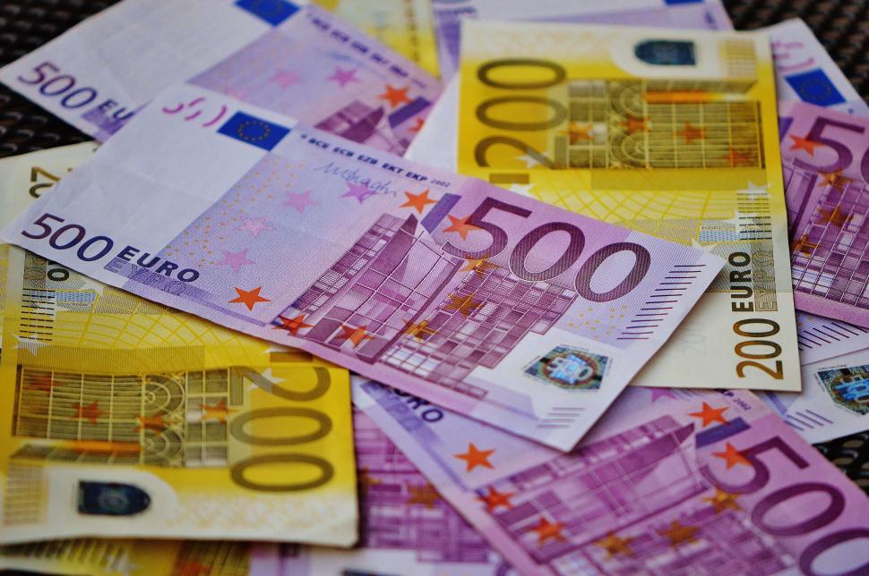 Free Image of A pile of money on a table 