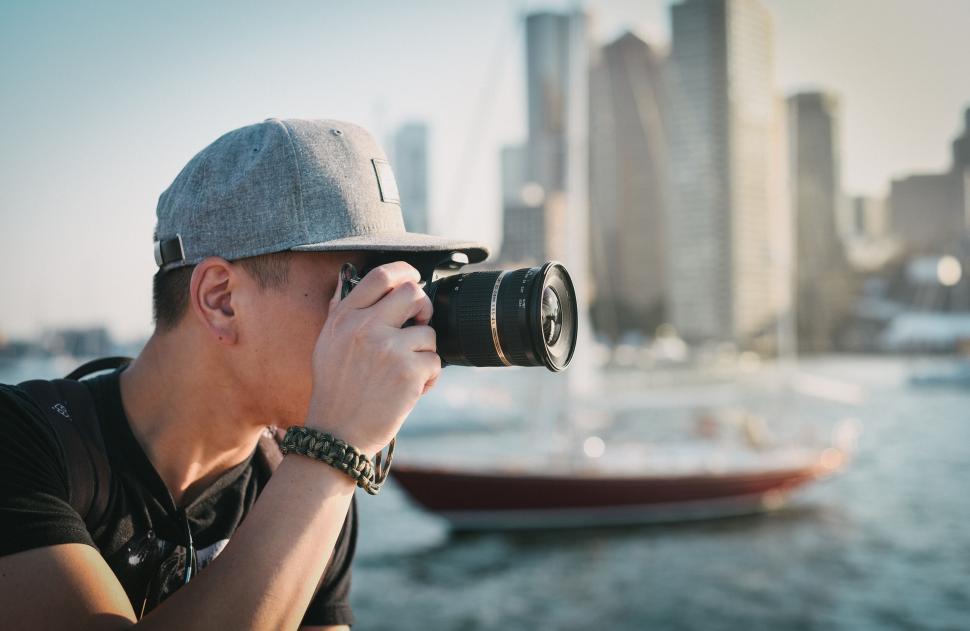 Free Image of A man taking a picture with a camera 