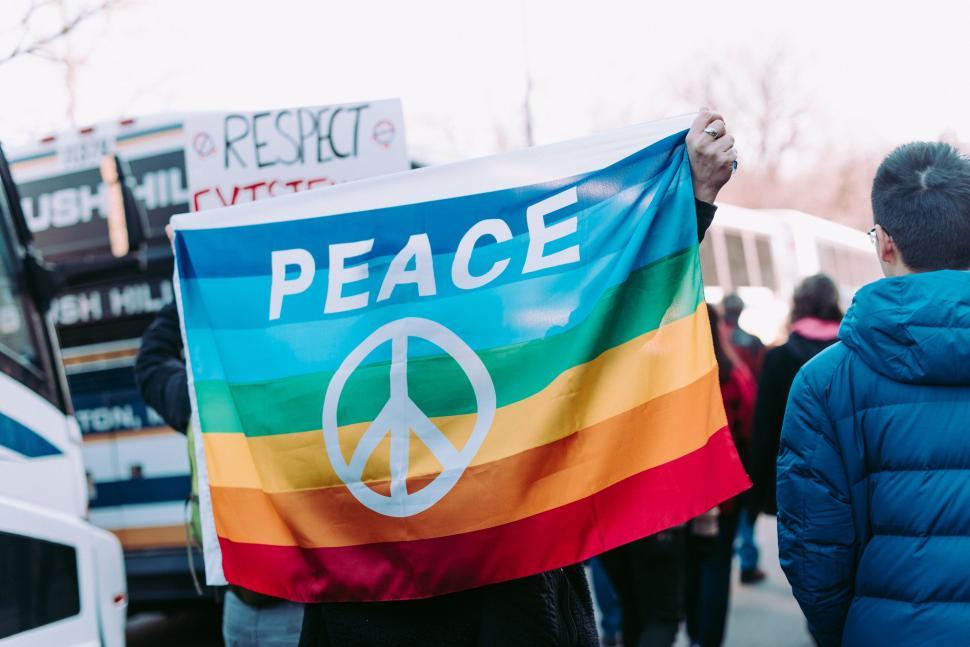 Free Image of A person holding a rainbow flag 