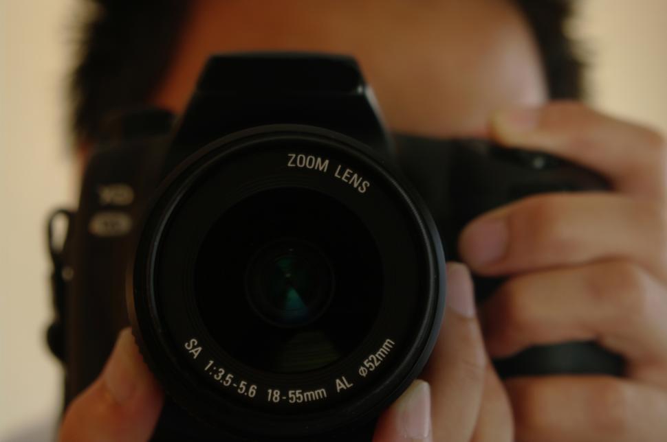 Free Image of Man Holding Camera Up to His Face 