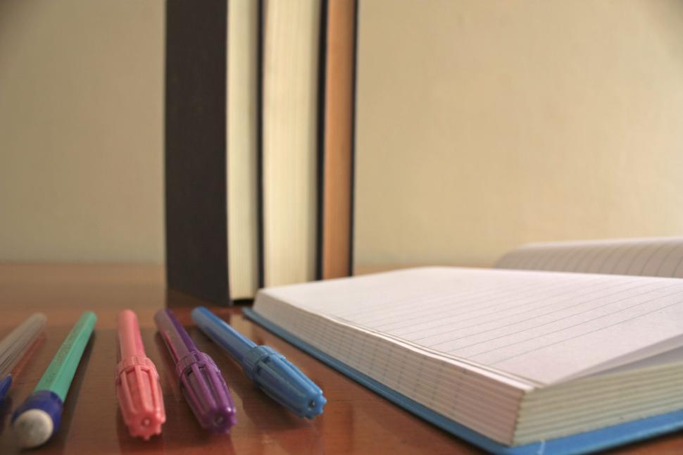 Free Image of Open Book on Wooden Table 