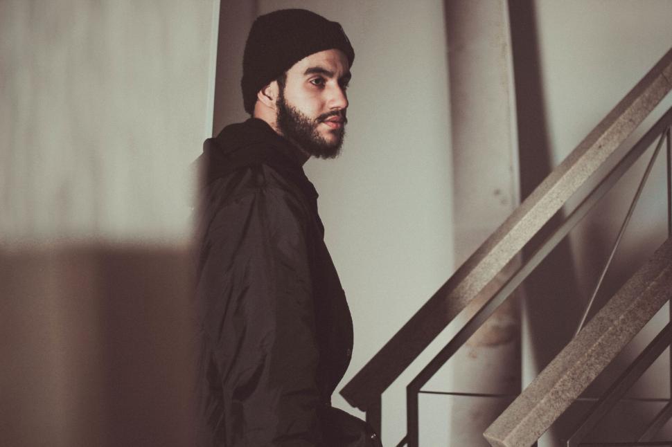 Free Image of A man in a beanie and a black jacket 