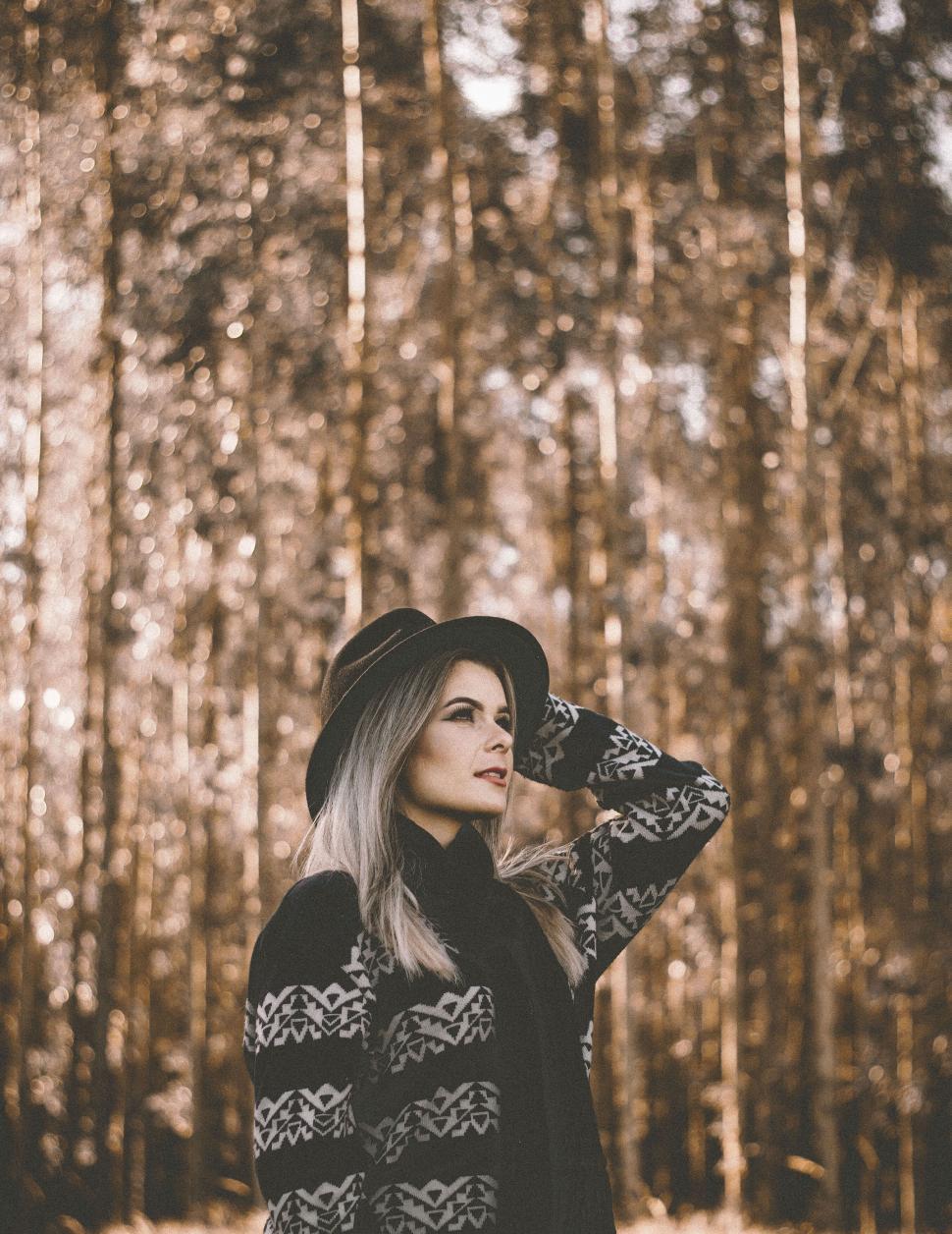 Free Image of A woman in a hat and scarf 