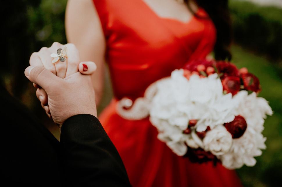 Free Image of A man holding a woman s hand 