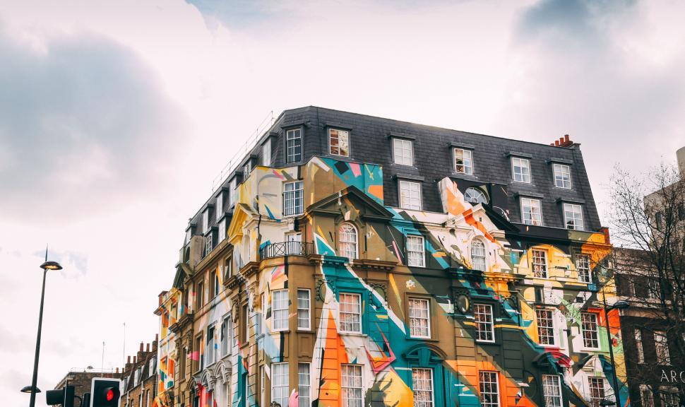Free Image of A multicolored building with many windows 
