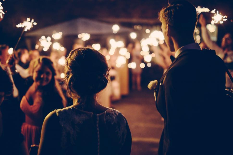 Free Image of A man and woman looking at fireworks 