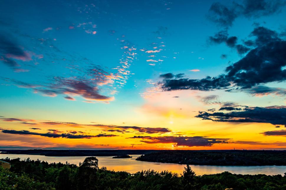 Free Image of A sunset over a body of water 