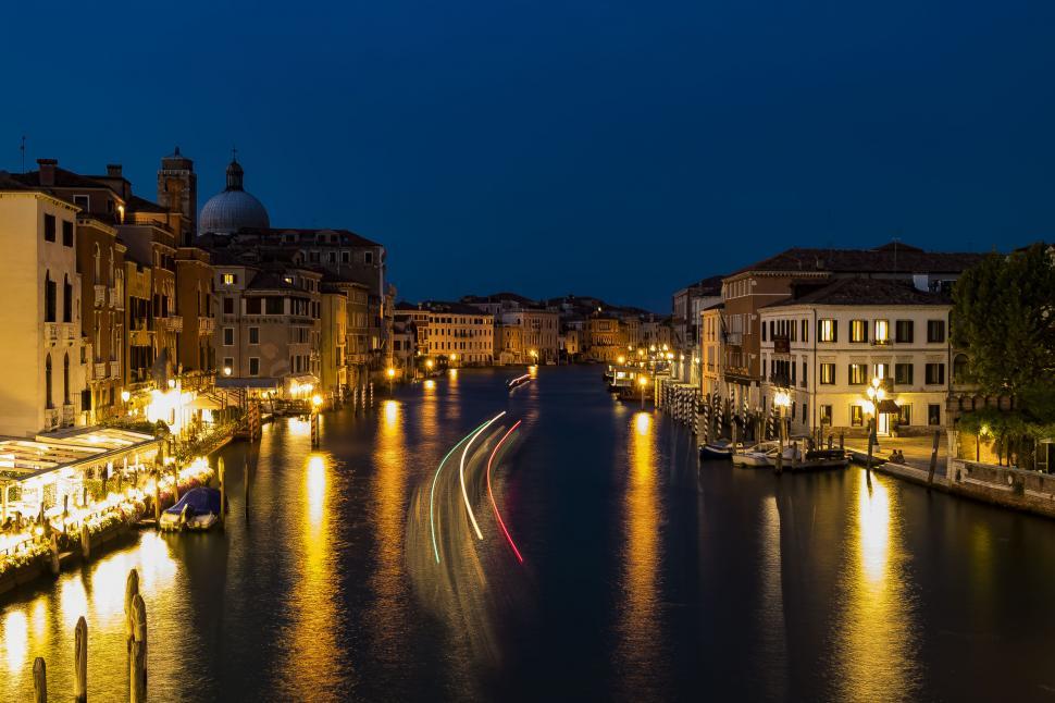 Free Image of A water way with lights on it 