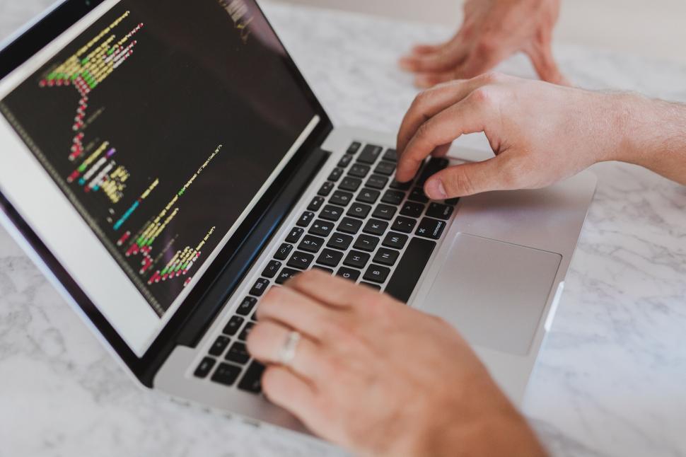 Free Image of A person typing on a laptop 