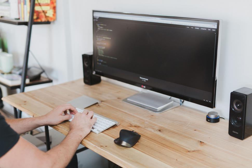 Free Image of A person typing on a keyboard 