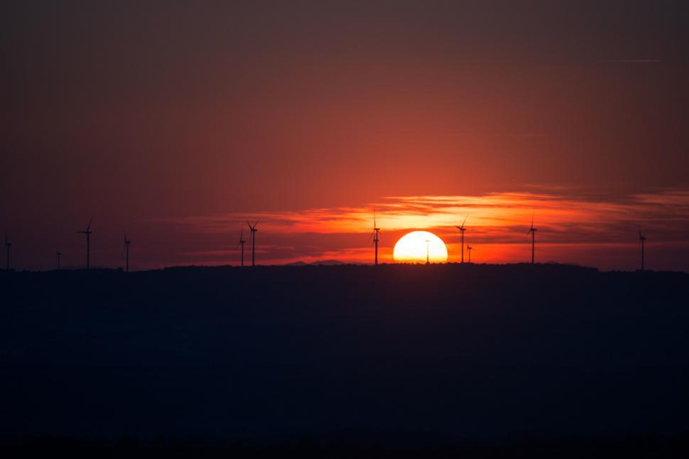 Free Image of Sun Setting Over Horizon of Field 