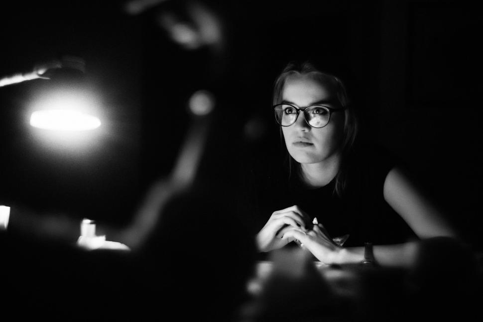 Free Image of A woman sitting at a table 