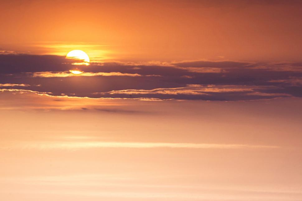 Free Image of A sun setting in the clouds 