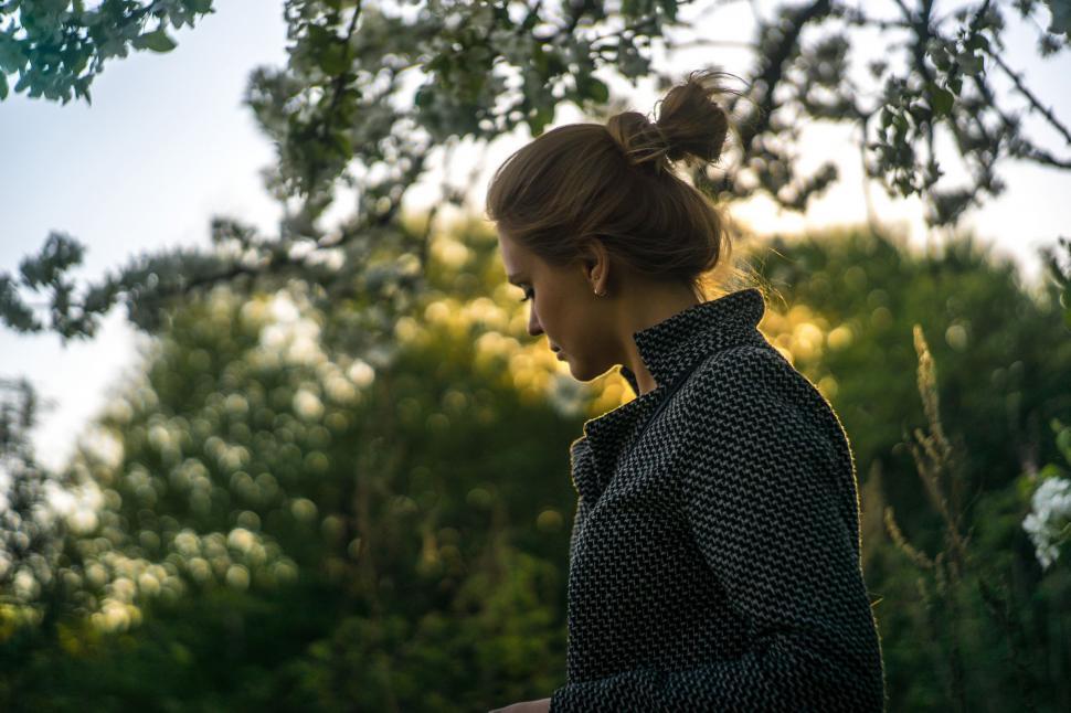 Free Image of A woman standing outside in the sun 