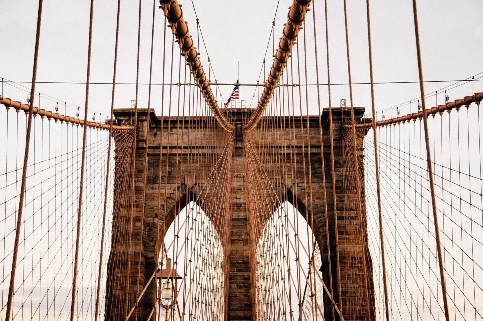 Free Image of A bridge with a flag on it 