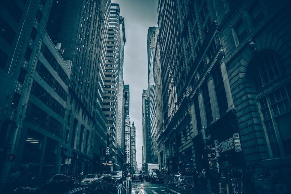 Free Image of A street with tall buildings and cars 