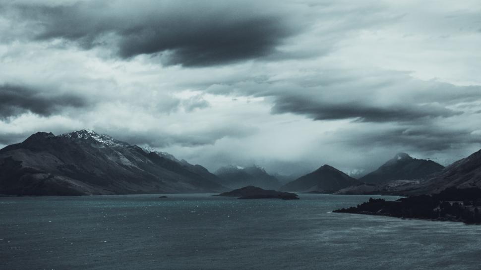 Free Image of Majestic Lake Surrounded by Towering Mountains 