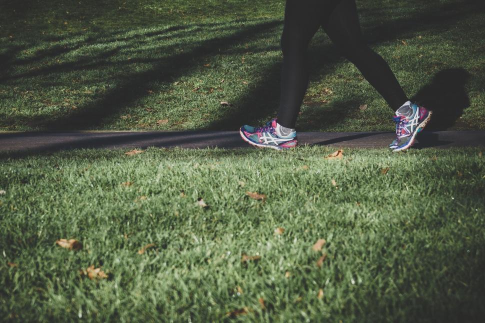 Free Image of A person walking on grass 