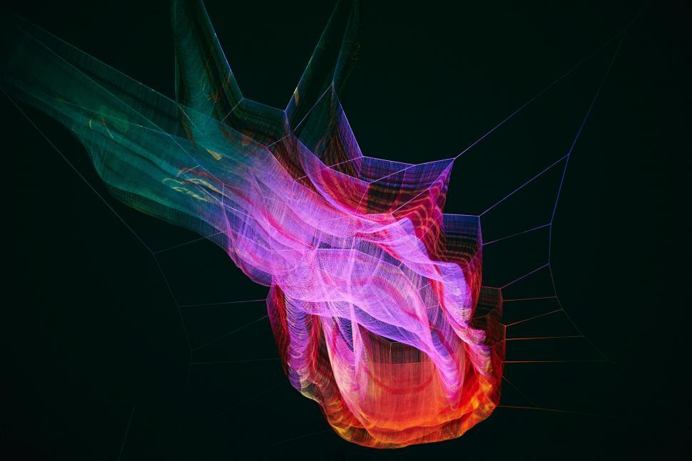 Free Image of A colorful spider web with many lines 