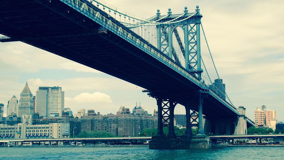 Free Image of A bridge over water with a city in the background 
