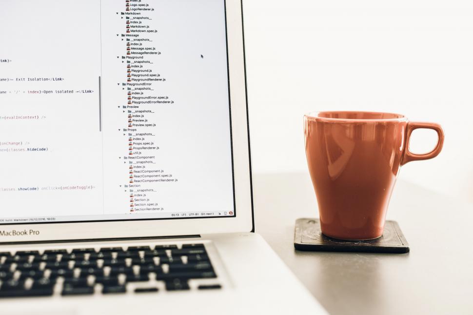 Free Image of A laptop and a cup 