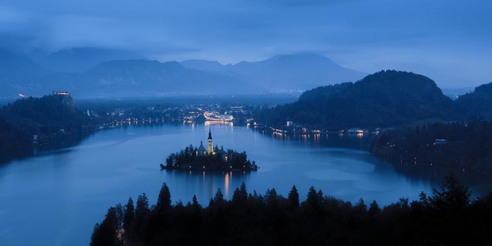 Free Image of A small island with a church on it surrounded by water 