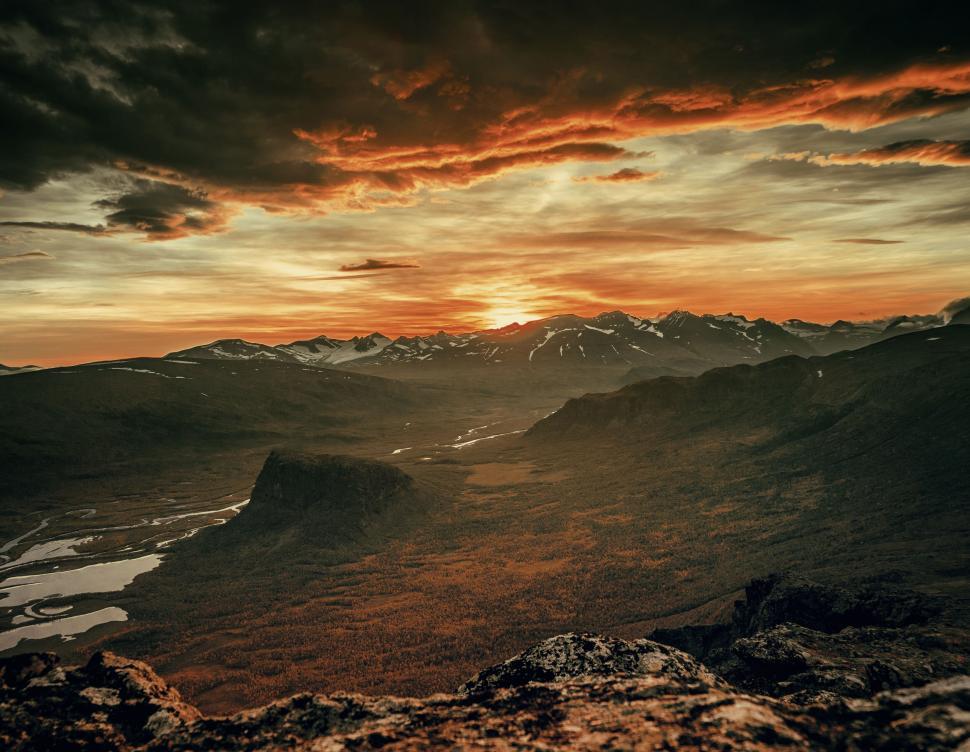Free Image of A landscape of mountains and a river 