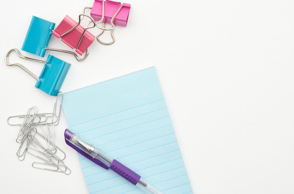 Free Image of A paper and paper clips and a pen 