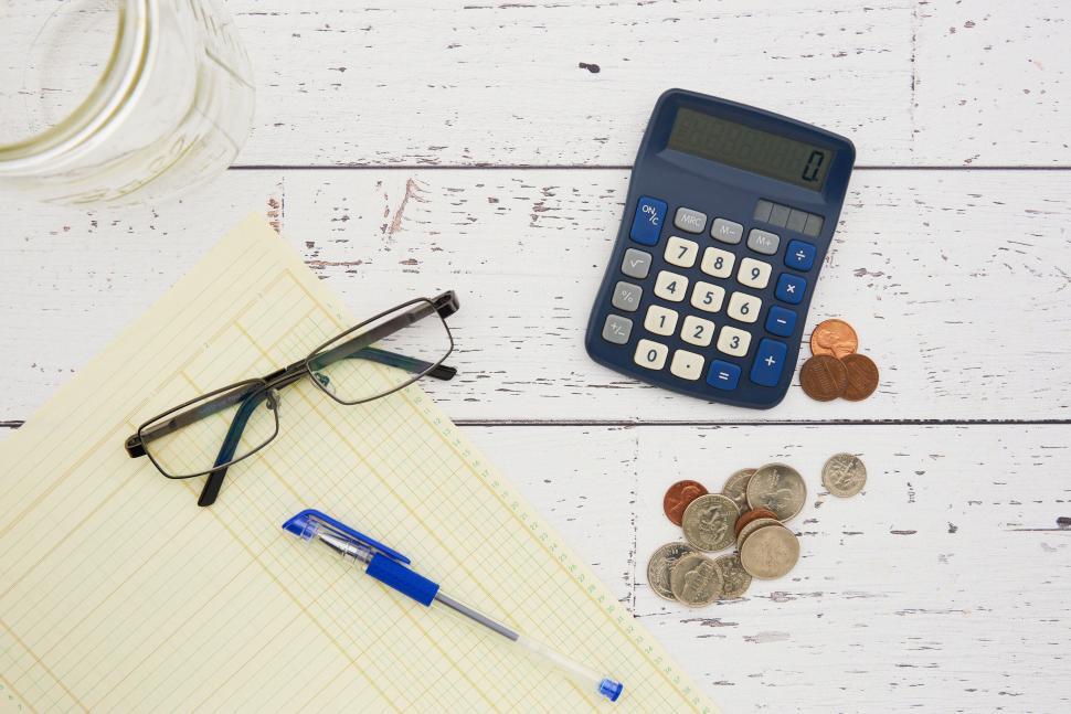 Free Image of A calculator and glasses on a table 